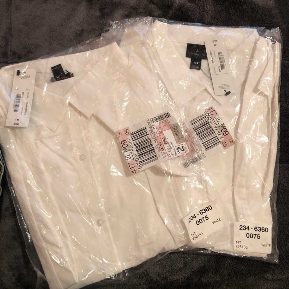 Two women’s button up dress shirts